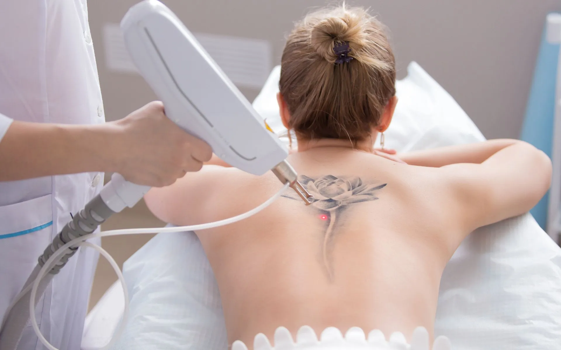 A woman getting her back shaved off